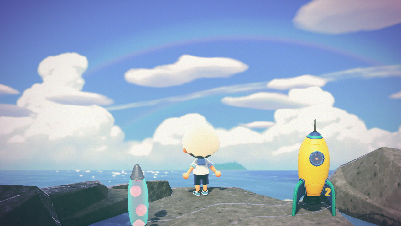 Player looks across ocean, rainbow and contrail in sky.