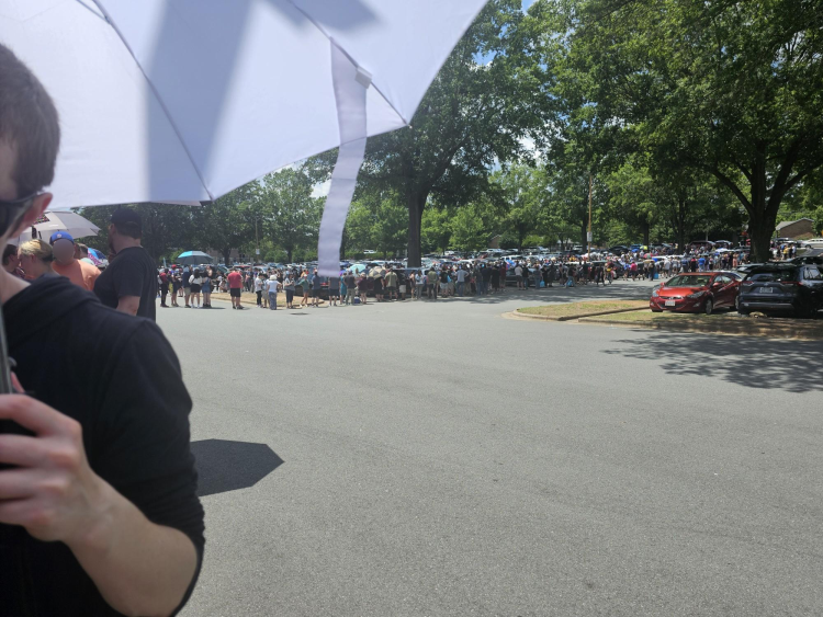 Photo of the line stretching through the Winston McKay's parking lot.